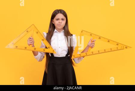 serious kid study math. angle degree measurement. trigonometry stationery. Stock Photo