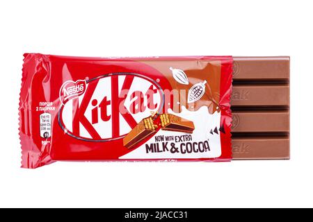 Ukraine, Kyiv - December 12. 2021: Opened Kit Kat chocolate bar. Kit Kat is a chocolate biscuit bar confection that is manufactured by Nestle isolated Stock Photo