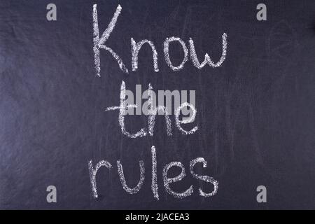 Know the rules inscription written chalk on black board. Business concept. Stock Photo