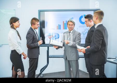 successful business man, conducting presentations to partners Stock Photo