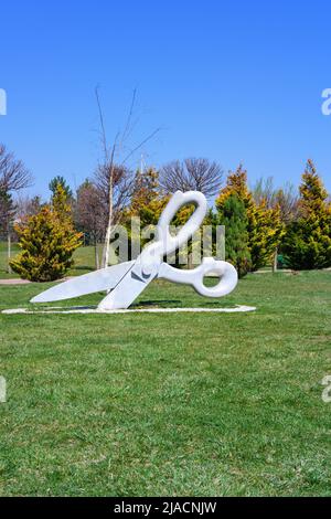 giant scissors cutting grass Stock Photo - Alamy