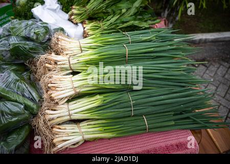 Chives on display at a local country market Stock Photo