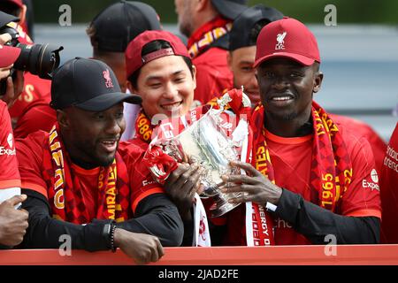 Liverpool, UK. 29th May, 2022. Naby Keita of Liverpool (l) Takumi Minamino of Liverpool (c) and Sadio Mane of Liverpool with the Carabao Cup. Liverpool Football Club victory parade in Liverpool on Sunday 29th May 2022. Liverpool FC celebrate this season's mens and women's teams achievements with an open top bus parade around Liverpool. Editorial use only. pic by Chris Stading/Andrew Orchard sports photography/Alamy Live news Credit: Andrew Orchard sports photography/Alamy Live News Stock Photo