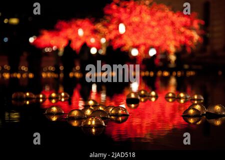 Decorative glass balls floating in water at Temple Square in Salt Lake City, Utah during Christmas festivities Stock Photo