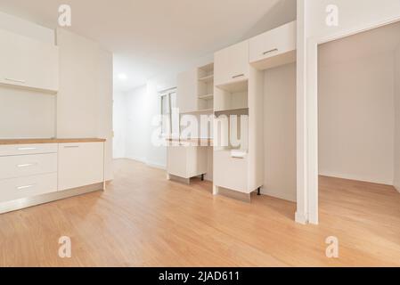 Photo of a newly installed kitchen awaiting appliances, open to a ...