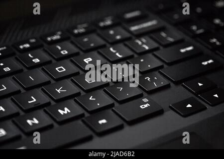 Close-up of computer keyboard, technological black and white background with selective focus Stock Photo