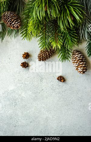 Overhead view of pinecones and fir branches on a table Stock Photo