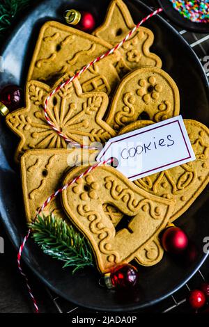 Overhead view of assorted gingerbread Christmas cookies on a plate Stock Photo