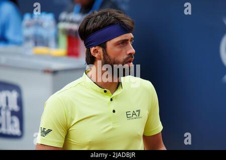 BARCELONA - APR 20: Nikoloz Basilashvili in action during the Barcelona Open Banc Sabadell Tennis Tournament at Real Club De Tenis Barcelona on April Stock Photo