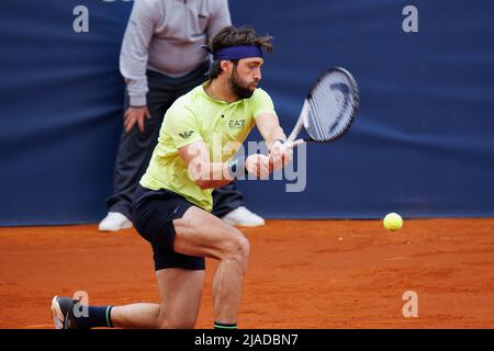 BARCELONA - APR 20: Nikoloz Basilashvili in action during the Barcelona Open Banc Sabadell Tennis Tournament at Real Club De Tenis Barcelona on April Stock Photo