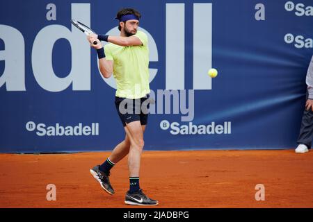 BARCELONA - APR 20: Nikoloz Basilashvili in action during the Barcelona Open Banc Sabadell Tennis Tournament at Real Club De Tenis Barcelona on April Stock Photo