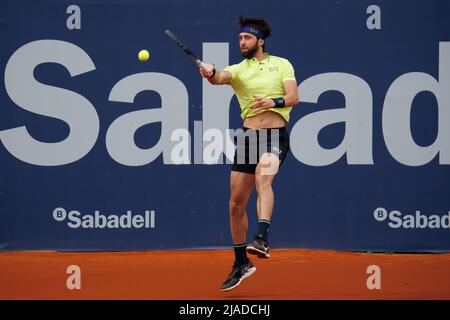 BARCELONA - APR 20: Nikoloz Basilashvili in action during the Barcelona Open Banc Sabadell Tennis Tournament at Real Club De Tenis Barcelona on April Stock Photo