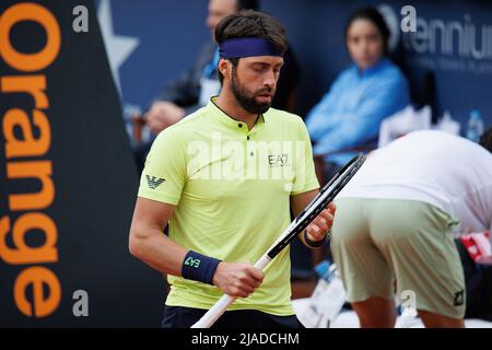 BARCELONA - APR 20: Nikoloz Basilashvili in action during the Barcelona Open Banc Sabadell Tennis Tournament at Real Club De Tenis Barcelona on April Stock Photo