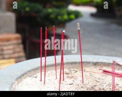 Senko candles smoldering in Vietnamese Budish temple Stock Photo