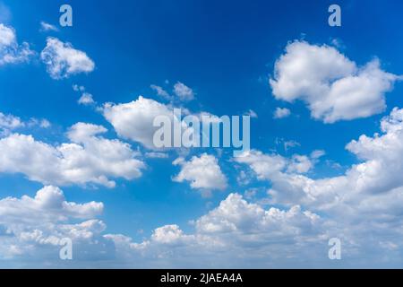 Blue sky background with many cumulus clouds Stock Photo