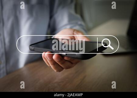 man searching Browsing Internet Data Search Engine Optimization Searching for information Stock Photo