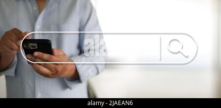 man searching Browsing Internet Data Search Engine Optimization Searching for information Stock Photo