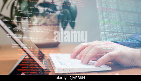 Businessman working with laptop computer on wooden desk in modern office . Programmers and cyber security technologies design. Stock Photo