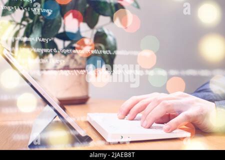 Businessman working with laptop computer on wooden desk in modern office . Programmers and cyber security technologies design. Stock Photo