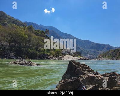 Rishikesh, Uttarakhand, India - March 8, 2020: View of ganga river and mountains and valleys in Rishikesh, India Stock Photo
