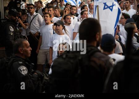Israeli youth at the march surrounded by police. About 70,000 right-wing Israelis participated in one of the biggest flag marches during Jerusalem Day celebrations. Jerusalem Day marks the unification of the city in the 1967 Israel - Arab war. The march passed through Damescus Gate and the Old City. Throughout the day violent clashes occured between Palestinians and the Israeli participators. Damascus Gate, Jerusalem. May 29th 2022. (Photo by Matan Golan/Sipa USA).
