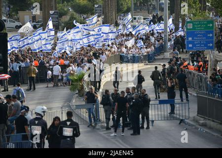 Israeli flags and celebrations in Damescus Gate. About 70,000 right-wing Israelis participated in one of the biggest flag marches during Jerusalem Day celebrations. Jerusalem Day marks the unification of the city in the 1967 Israel - Arab war. The march passed through Damescus Gate and the Old City. Throughout the day violent clashes occured between Palestinians and the Israeli participators. Damascus Gate, Jerusalem. May 29th 2022. (Photo by Matan Golan/Sipa USA).