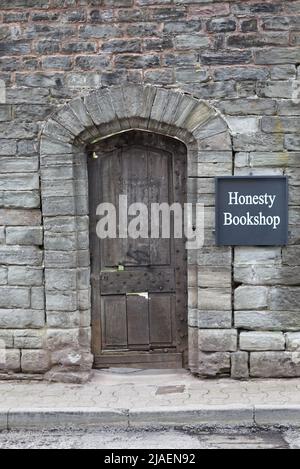 wooden door to Honesty bookshop hey on wye Stock Photo