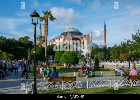 Tourists and locals around Sultanahmet park in front of the Hagia Sophia or Ayasofya in Istanbul. Stock Photo