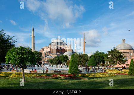 Tourists and locals around Sultanahmet park in front of the Hagia Sophia or Ayasofya in Istanbul. Stock Photo