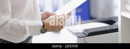 Woman working with papers in office Stock Photo