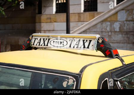 Damascus, Syria - May, 2022: Taxi sign closeup on Taxi car in street traffic of Damascus Stock Photo