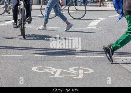 street scene with pedestrians and cyclists Stock Photo