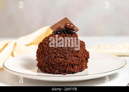 Special design chocolate cake. Chocolate covered cake on a white background. close up Stock Photo