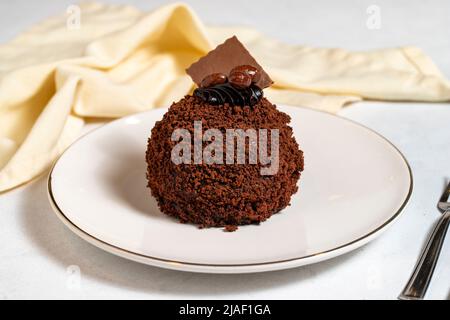 Special design chocolate cake. Chocolate covered cake on a white background. close up Stock Photo