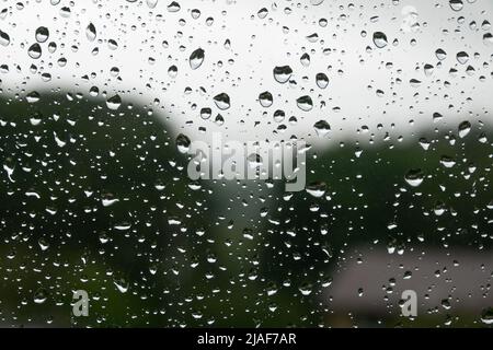 Rain drops on the car windglass background. Rainy day background Stock Photo