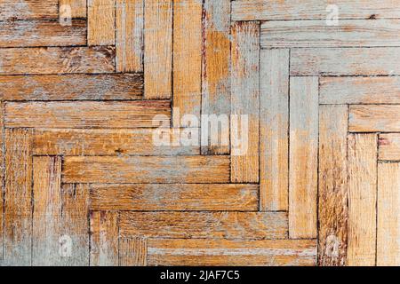 Old weathered grungy parquet made of rectangular wooden planks, top view. Background photo texture Stock Photo