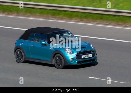 2017 Turquoise Mini Cooper S Works 210 1998cc petrol 6 speed manual; driving on the M61 Motorway, Manchester, UK Stock Photo