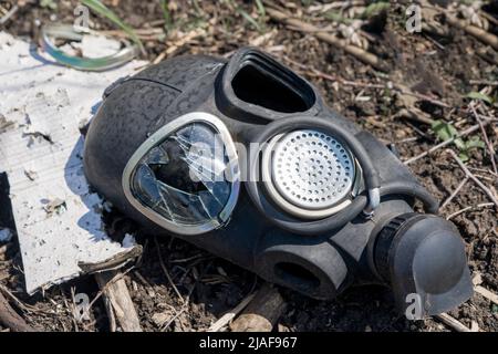 War Ukraine. Broken gas mask of Russian terrorists. Killed soldier in Ukraine Stock Photo