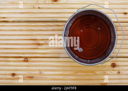 Special waterproof protective oil on larch floor as pattern or background. Copy space. View from above. Stock Photo
