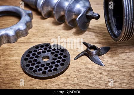 Disassembled Manual Vintage Meat Grinder On Wooden Table. Hand Tool For  Grinding Various Products. Antique Kitchen Utensils. Stock Photo, Picture  and Royalty Free Image. Image 152877034.