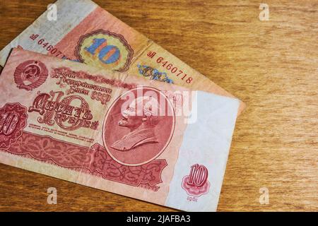 Vintage soviet banknotes on a wooden table Stock Photo