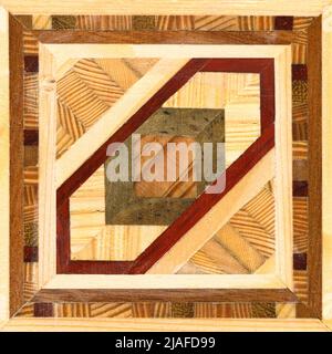 Wooden marquetry, patterns created from the combination of different woods, wooden floor, parquet, cutting board Stock Photo