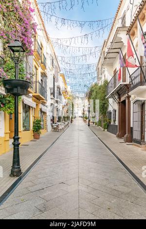 a view down the traditional Spanish streets in the old town center of Marbella Stock Photo