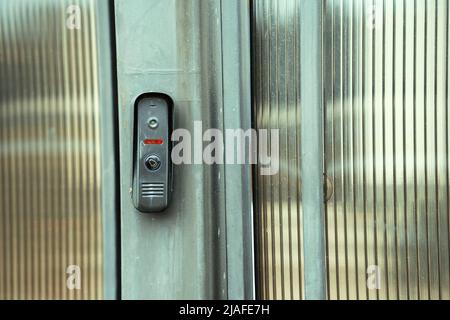 intercom panel with a video camera on the brick fence of private house Stock Photo