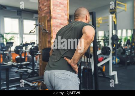 Young muscular man does lower chest exercises with machine in modern gym  Stock Photo - Alamy