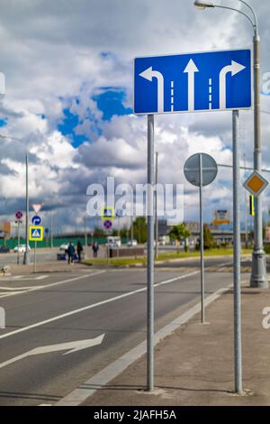 Moscow, Russia - May 28, 2022: road sign with arrows indicating the direction of travel. High quality photo Stock Photo