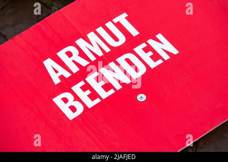 End Poverty, Call To Politics And Social Conscience. White Writing On Red Background. Stock Photo