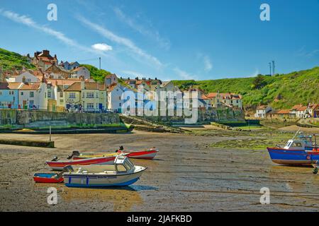 Harbour and village with the 'Cod & Lobster' Inn at Staithes, North Yorkshire, England. Stock Photo