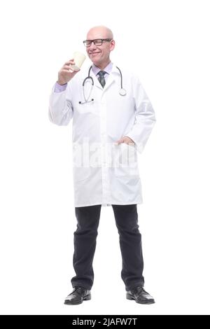 smiling doctor with a takeaway coffee. isolated on a white Stock Photo