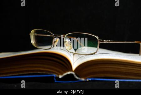 open old book on dark background Stock Photo